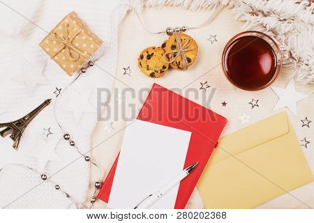 Mockup With A Cup Of Tea, Cookies With Chipped Chocolade, Present Box, Little Eiffel Tower, Blank Pa