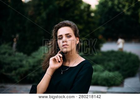 Beautiful Young Girl In The Park On A Summer Evening.