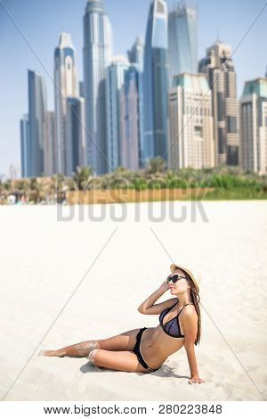 Sexy Beautiful Woman Lying Relaxing And Sunbathing In Bikini On Sea Background And Palm Tree. Panora