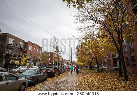 Montreal, Canada - November 6, 2018: People Walking With During A Rainy Autumn Afternoon In A Street