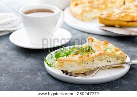 Pie With Salted Soft Cheese And Greens Closeup