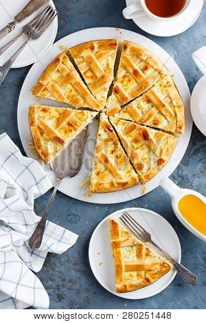 Pie With Salted Soft Cheese And Greens, Top View