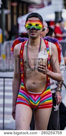 San Francisco, California, June 24, 2018:  Gay Pride Parade - Man Wears Rainbow Thong And Mask In Su