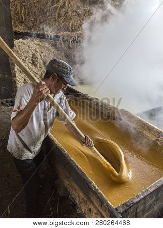 Vilcabamba, Ecuador - Jan 20, 2014: Raw Sugar Is Being Stirred Before Being Pouring Into Molds