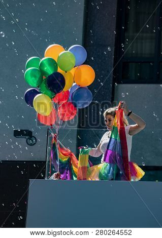 San Francisco, California, June 24, 2018:  Gay Pride Parade - Woman Prepares Balloons Amid Bubbles F