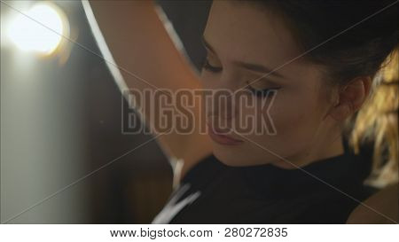 Beautiful Girl In Underwear Straightens Hair. Girl In Black Bodysuit.. Beautiful Girl In A Black Bod