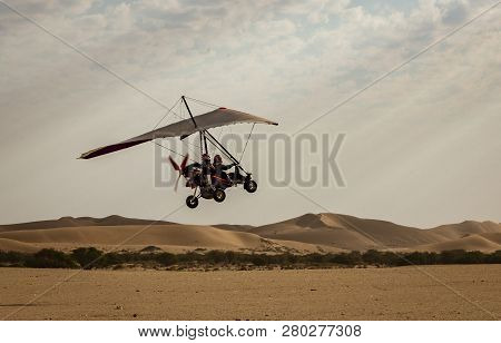 Walvis Bay, Namibia - July 16, 2018: An Ultralight Aircraft Takes Off From An Improved Dirt Runway I