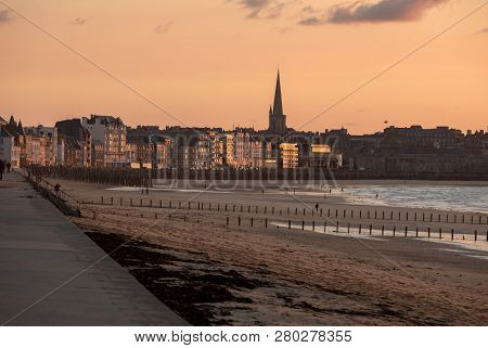 Saint-malo, France - September 13, 2018:the Evening Light On The Plage Du Sillon And Walled City. Sa