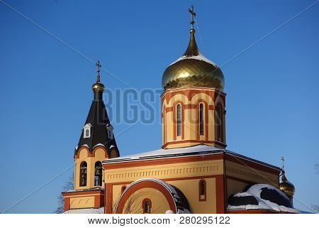 White Orthodox Church Against The Blue Sky