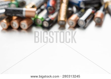 Background Of Defocused Batteries With Space For Text.