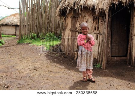 Ngorongoro - Tanzania/ March, 2016: Young Girl At The Front Of Her Hut In A Masai Village North Of T