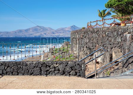 Puerto Del Carmen Beach In Lanzarote, Canary Islands, Spain. Blue Sea, Palm Trees, Selective Focus
