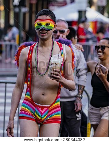 San Francisco, California, June 24, 2018:  Gay Pride Parade - Man Wears Rainbow Thong And Mask In Su