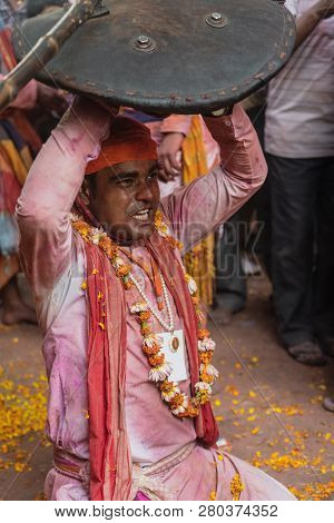 Barsana, India - February 24, 2018 - Lathmar Holi Festival - Women Beat Men With Bamboo Sticks Until