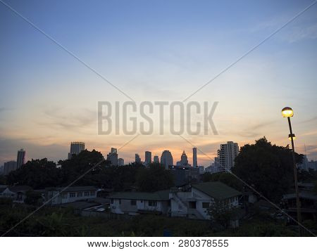 Dramatic View Of Cityscape And Home On Sunset At Khlong Toei , Bangkok , Thailand