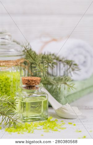 Natural Cosmetic Oil, Sea Salt And Organic Facial Mask With Coniferous Extract On White Rustic Woode