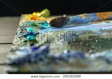 Oil Art Paints On A Very Old Palette. Close-up