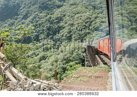 Parana, Brazil - December 17, 2018: Train Crossing The Bridge On The Mountains. Serra Do Mar Paranae