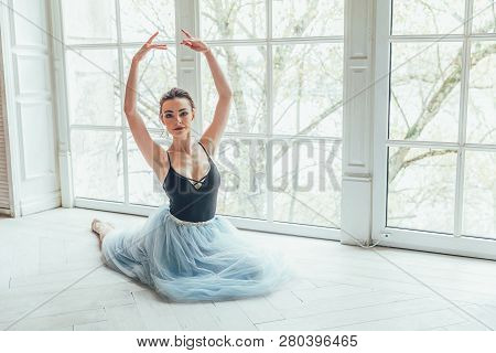 Young Classical Ballet Dancer Woman In Dance Class. Beautiful Graceful Ballerina Practice Ballet Pos