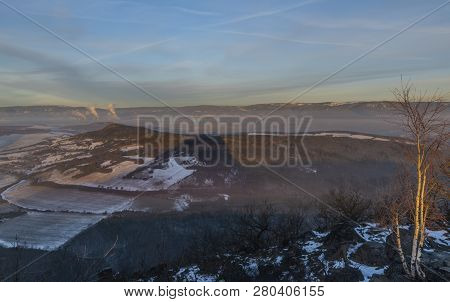 Sunrise On Boren Hill Near Bilina Town In Winter Frosty Color Morning