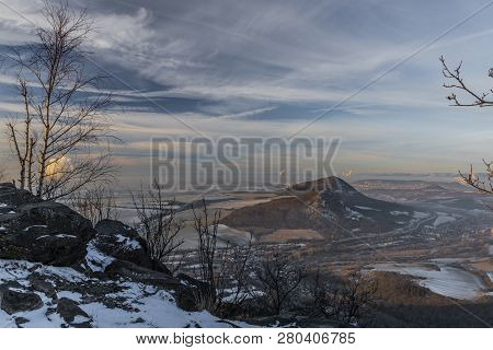 Sunrise On Boren Hill Near Bilina Town In Winter Frosty Color Morning