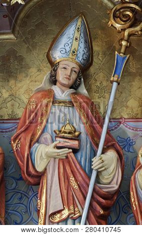 PETSCHIED, ITALY - JULY 14, 2018: Saint Nicholas statue on the main altar in the Saint Nicholas church in Petschied near Luson, Italy