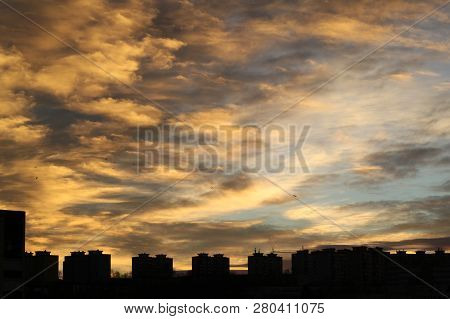 Colors And Lights Of The Sun Reise On The Sky  Above The City