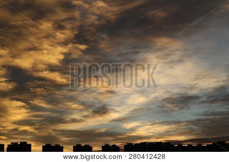 Colors And Lights Of The Sun Reise On The Sky Above The City