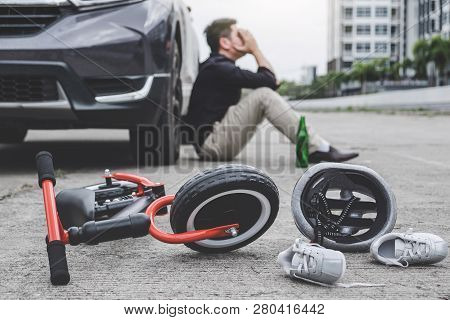 Image Of Shocked And Scared Driver After Accident Involved Kid's Bike And Helmet Lying On The Road O