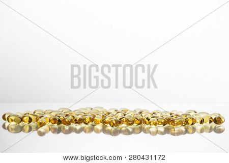 Fish Oil Supplement Capsules Isolated On White Background