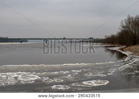 A Bridge Over A Large River. Crossing For Passenger Cars Over The Vistula. Season Winter.
