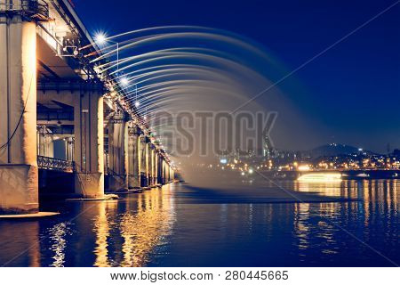SEOUL, SOUTH KOREA - APRIL 7, 2017:  Banpo Bridge Rainbow Fountain on Han river  illuminated at night, Seoul, South Korea