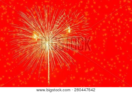 Golden Fireworks Celebration On Bright Red Background.