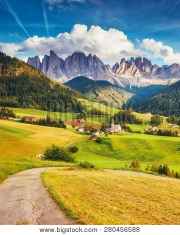 Countryside view of the Funes valley St. Magdalena or Santa Maddalena in the National park Puez Odle or Geisler. Dolomiti, South Tyrol. Location Bolzano, Italy, Europe. Dramatic scene. Beauty world.