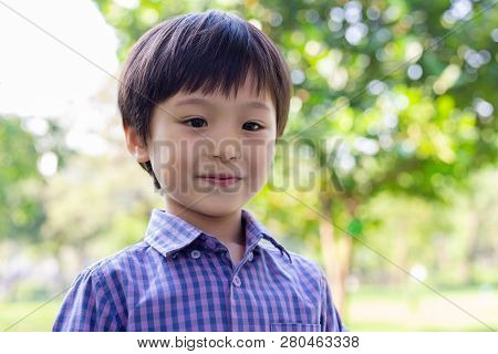 Portrait Handsome Little Boy. Attractive Handsome Young Boy Feels Happy When Cute Kid Go To Outdoor.