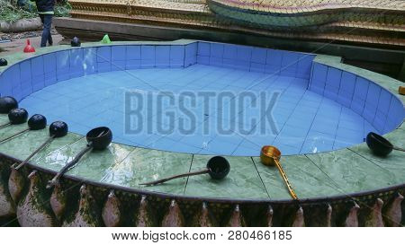 The Sacred Pond With And Many Water Bowl Placed On The Edge Of The Pond In Kham Chanot Forest Accord