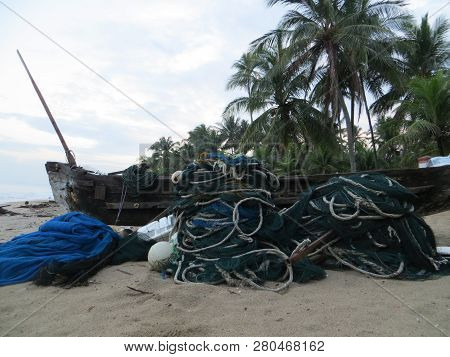 Anyer, Indonesia - June 27, 2018: A Pile Of Fish Net Lying On The Sand Of Sambolo Beach.
