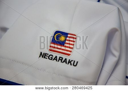 Close-up Of Embroidery Malaysia Logo With Wording Negaraku (my Country) On White Uniform