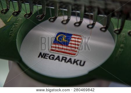 Close-up Of Embroidery Malaysia Logo With Wording Negaraku (my Country) On White Uniform