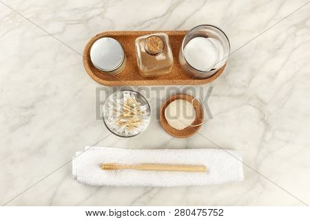An Overhead Photo Of Sustainable Toiletries. Homemade Lotions, Cotton Pads, Bamboo Toothbrush, Natur