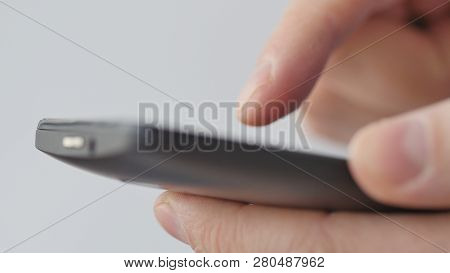 Close-up Of Hands Holding Smartphone, Typing Text On Touch Screen And Using Applications. A Person T
