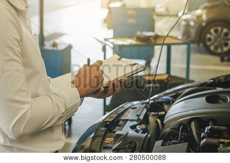 This Career Man Saleman Business Inspection Writing Note On Notepad Or Book, Paper With Car Blurry B