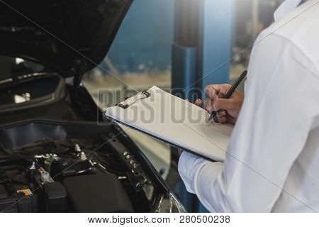 This Career Man Saleman Business Inspection Writing Note On Notepad Or Book, Paper With Car Blurry B