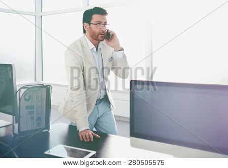 background image of a businessman in a modern office.