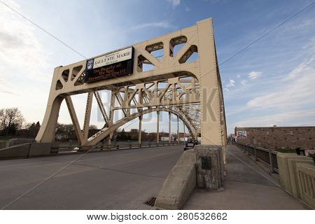 Sault Ste Marie, Michigan, Usa - May 6, 2016: Bridge And Welcome Sign In  Downtown Sault Ste Marie. 