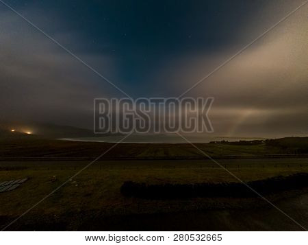 Very Rare Moonbow During The Night Above Staffin Bay