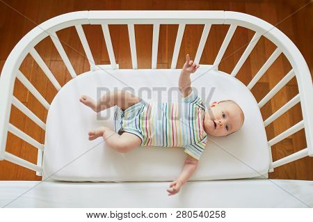 Baby Girl In Co-sleeper Crib