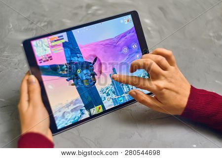 Bishkek, Kyrgyzstan - January 21, 2019: Woman Playing Fortnite Game Of Epic Games Company On Apple I