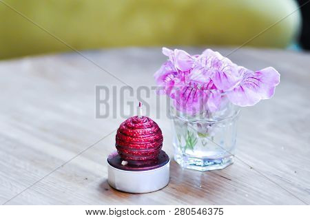 Flower In The Vase And Candle On The Table