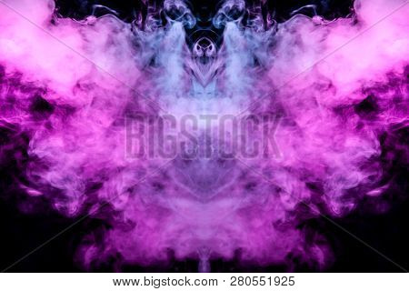 Ghostly Bat Silhouette With Wings From Colorful Smoke Waves Evaporating From A Vap Illuminated By Ne
